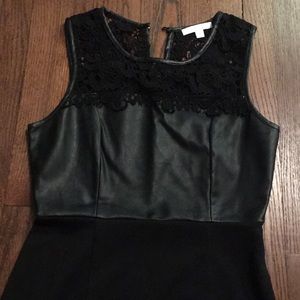 Black cocktail dress with leather bodice and lace.